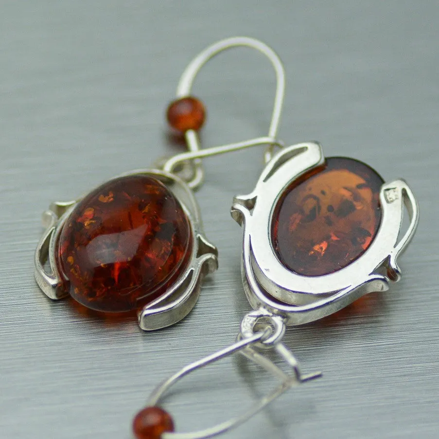 Oval Amber dangly silver earrings