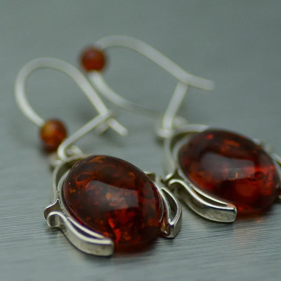Oval Amber dangly silver earrings